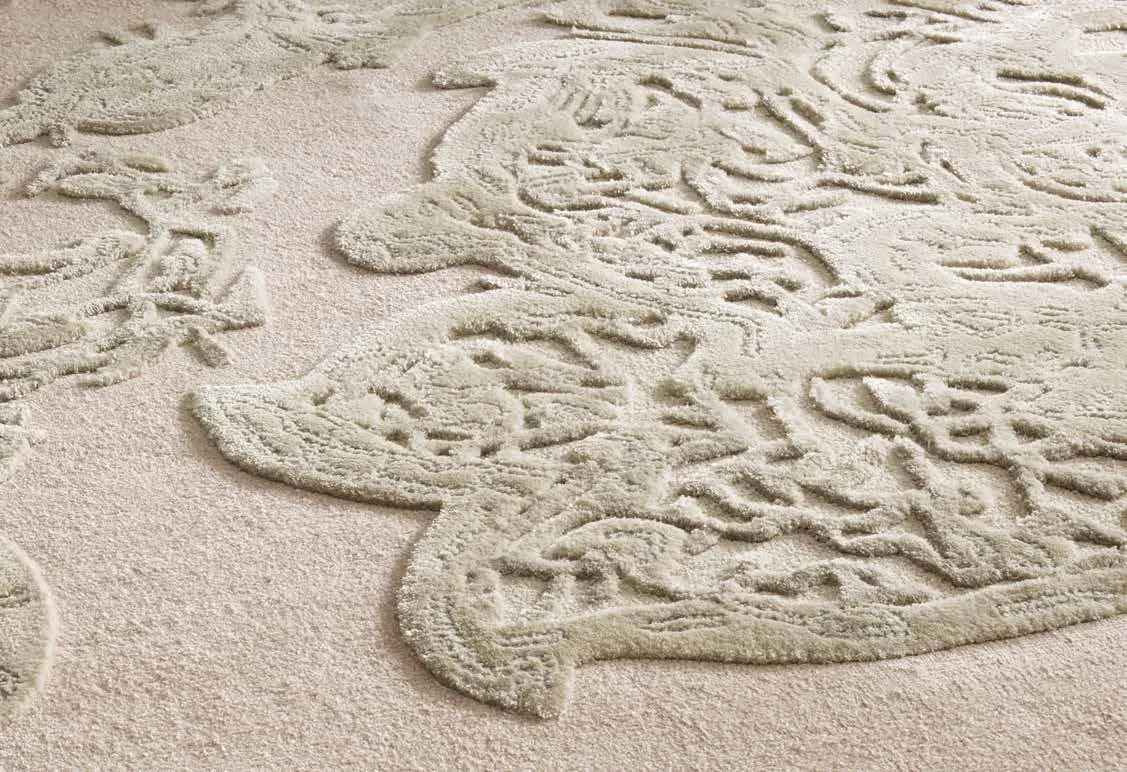 Hand-carved wool rug with a scrolling relief pattern